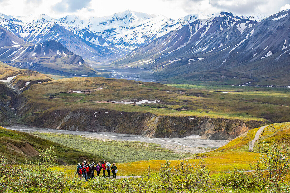 A Park Ranger leads a tour of visitors on a nature hike near the Eielson Visitor Center, Denali National Park and Preserve, Interior Alaska; Alaska, United States of America