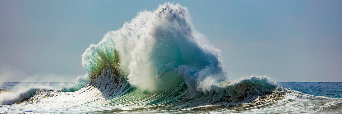 Ocean waves crashing into the shore off the Na Pali coast; Kauai, Hawaii, United States of America