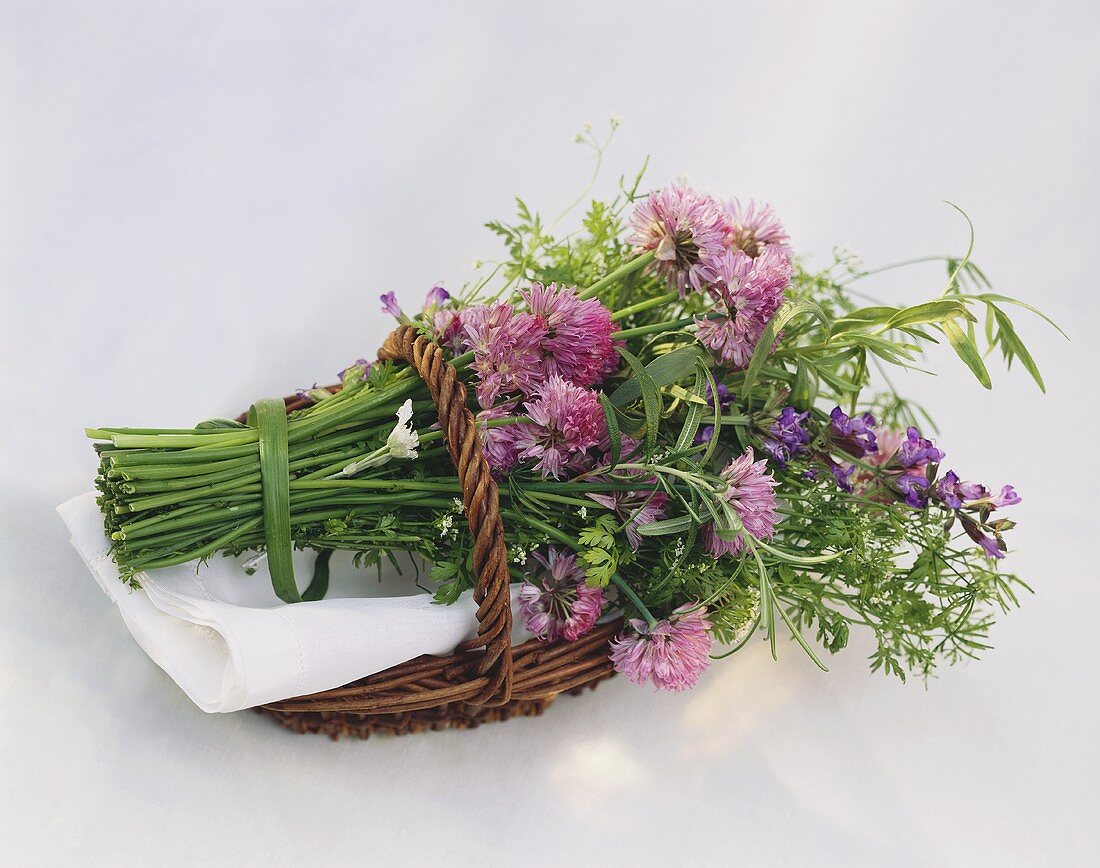 Flowering herbs in wicker basket