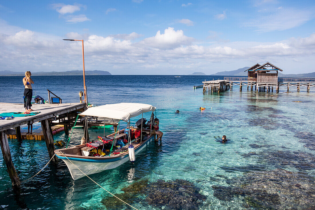 Pier over the coral reef; Arborek, West Papua, Indonesia