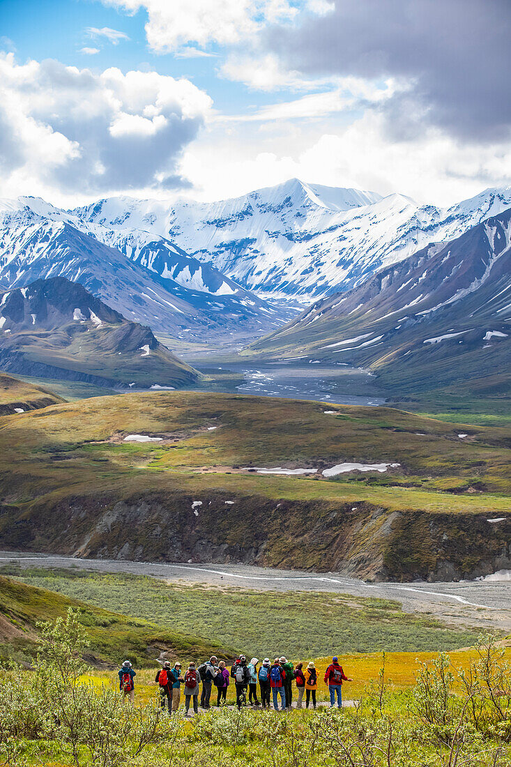 A Park Ranger leads a tour of visitors on a nature hike near the Eielson Visitor Center, Denali National Park and Preserve, Interior Alaska; Alberta, Canada