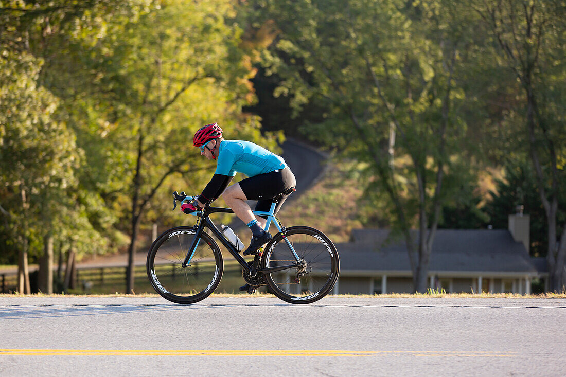 Cyclist riding on a road, near Trace Nachez Bridge; Franklin, Tennessee, United States of America