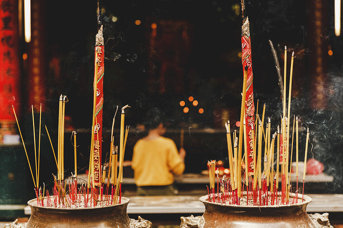 Worshiper at Thien Hau Temple; Ho Chi Minh City, Vietnam