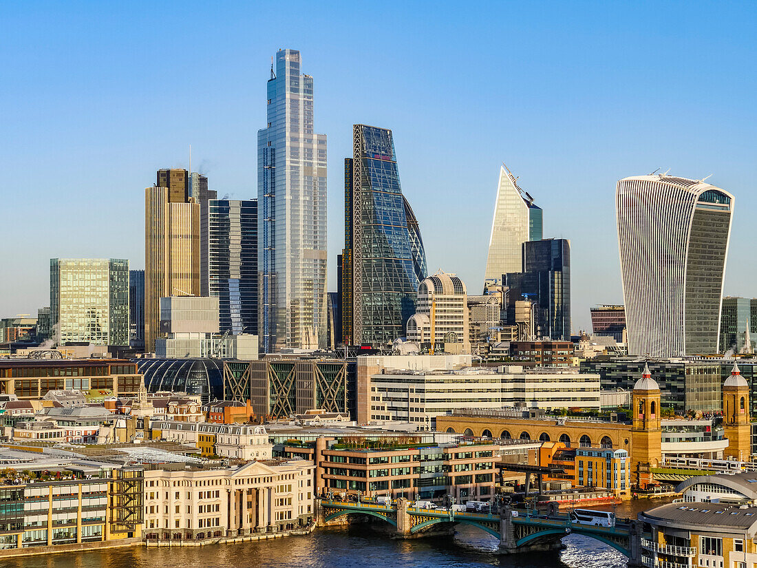 Cityscape and skyline of London with 20 Fenchurch, 22 Bishopsgate, and various other skyscrapers, and the River Thames in the foreground; London, England