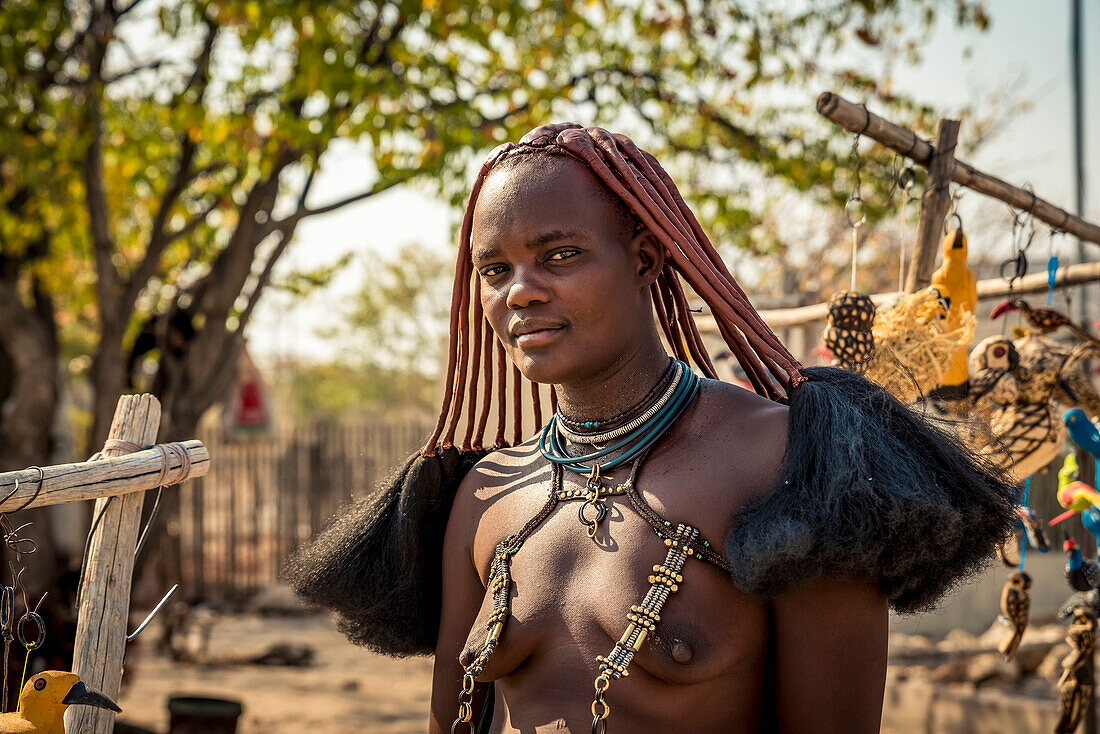Himba woman selling crafts at Etosha's Anderson Gate, Etosha National Park; Namibia