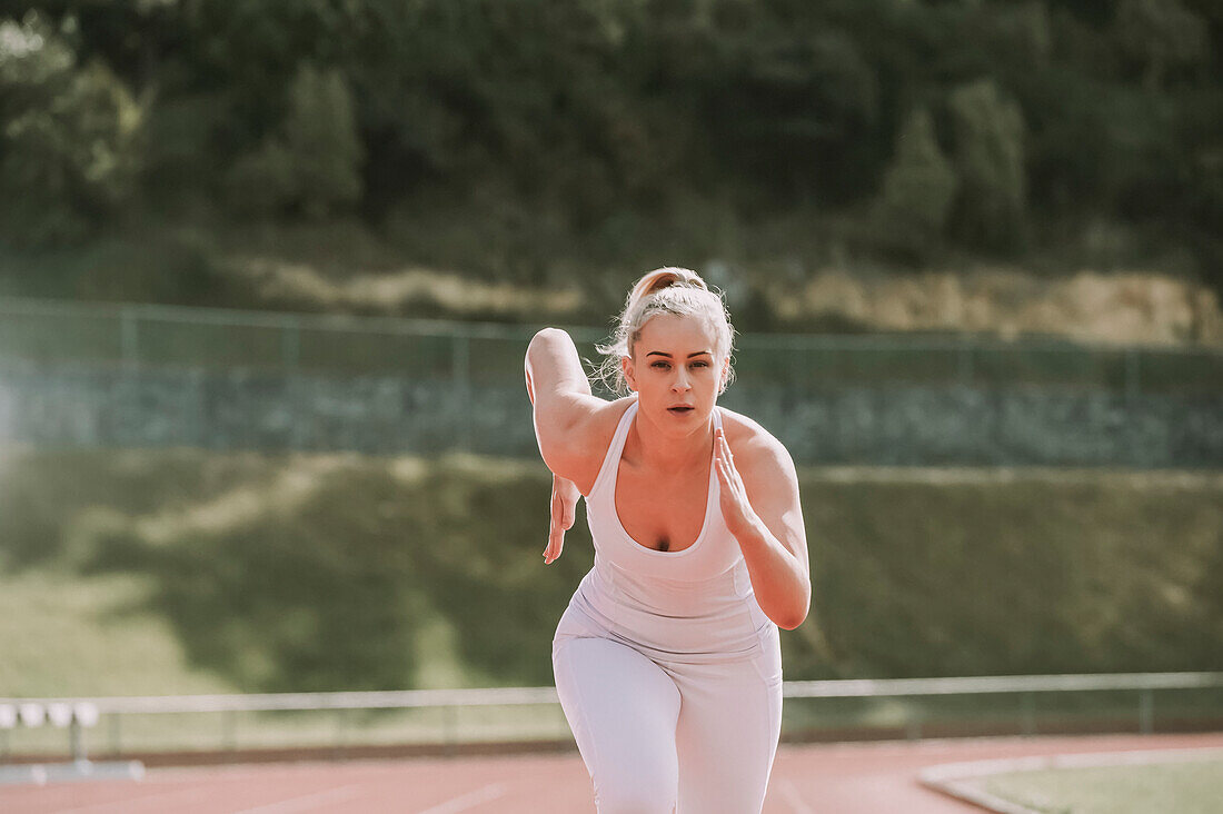 Woman running on a track; Wellington, New Zealand