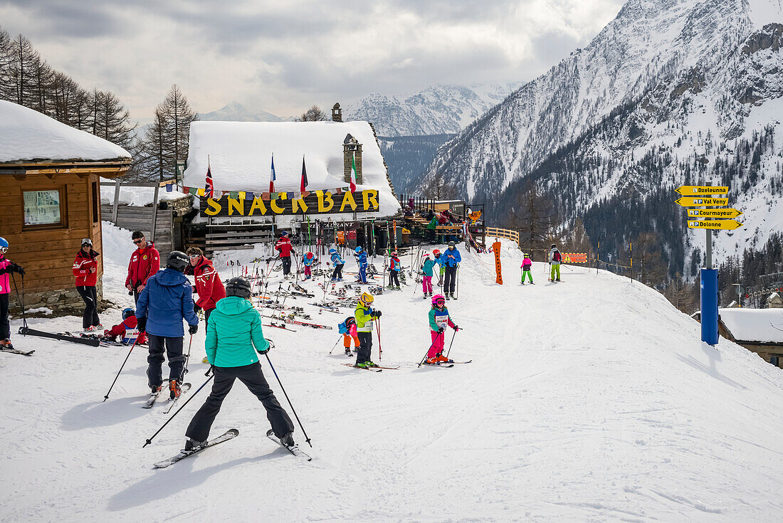 Skiers at an alpine resort, Italian side of Mont Blanc; Courmayeur, Aosta Valley, Italy