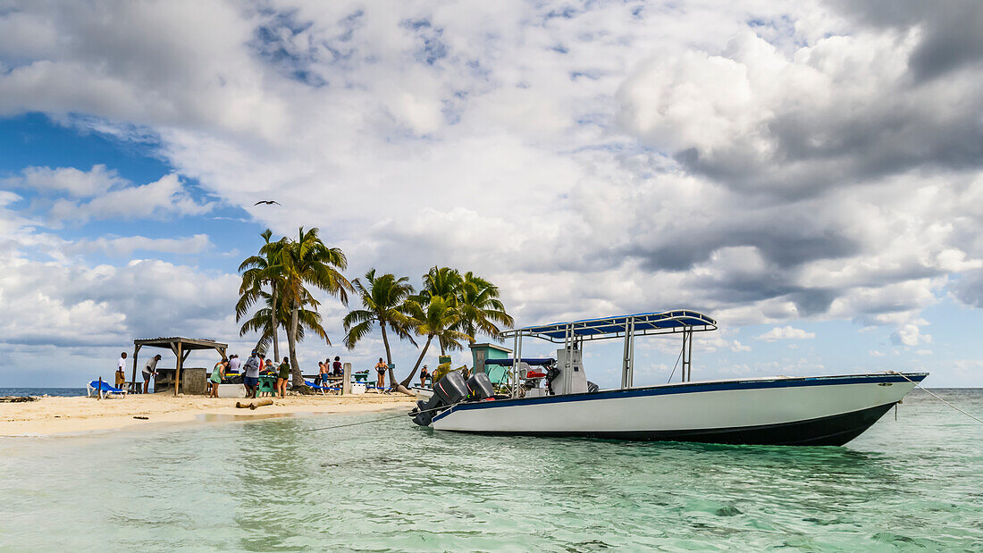 Boat moored at Silk Caye, Marine Reserve, Caribbean Ocean; Belize