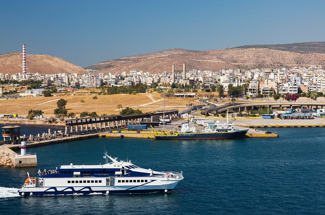 Seajets ferry and Eakebe commercial ship docked in Piraeus port; Piraeus, Athens, Greece