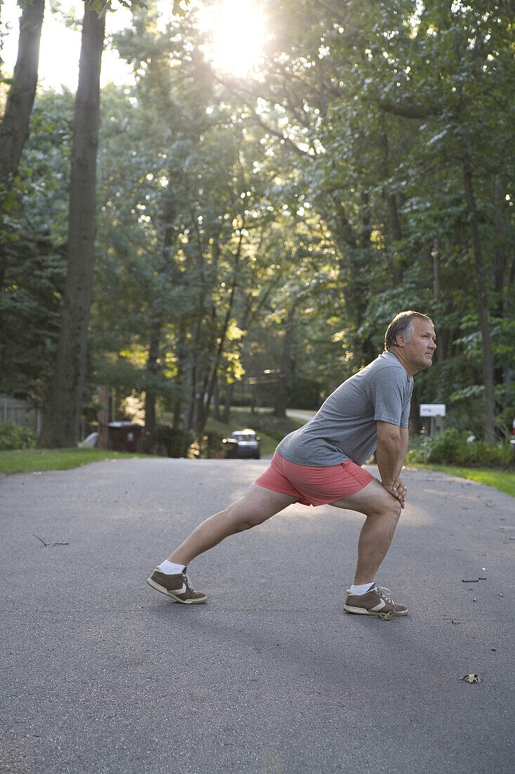 Man Stretching Before Morning Run