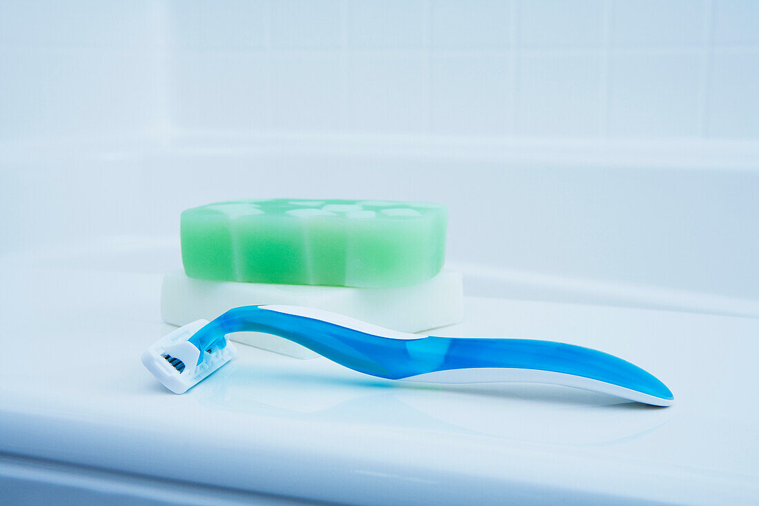 Soap and Razor on edge of Tub