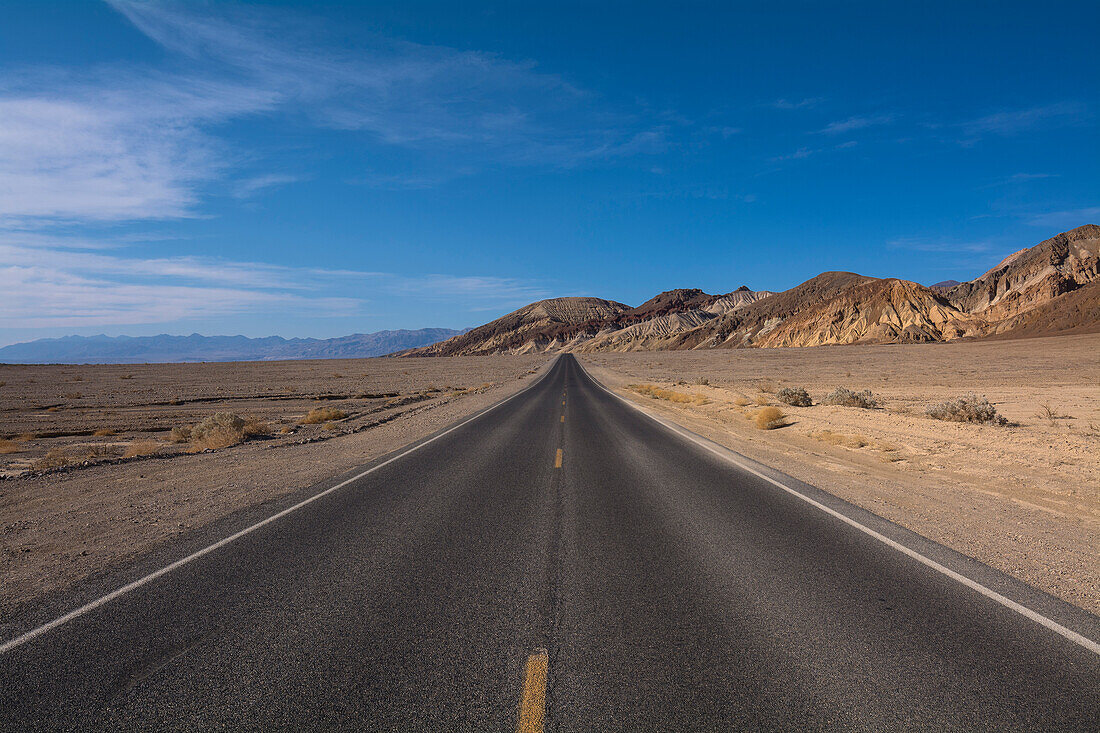 Paved Road in Desert Landscape, Death Valley National Park, California, USA