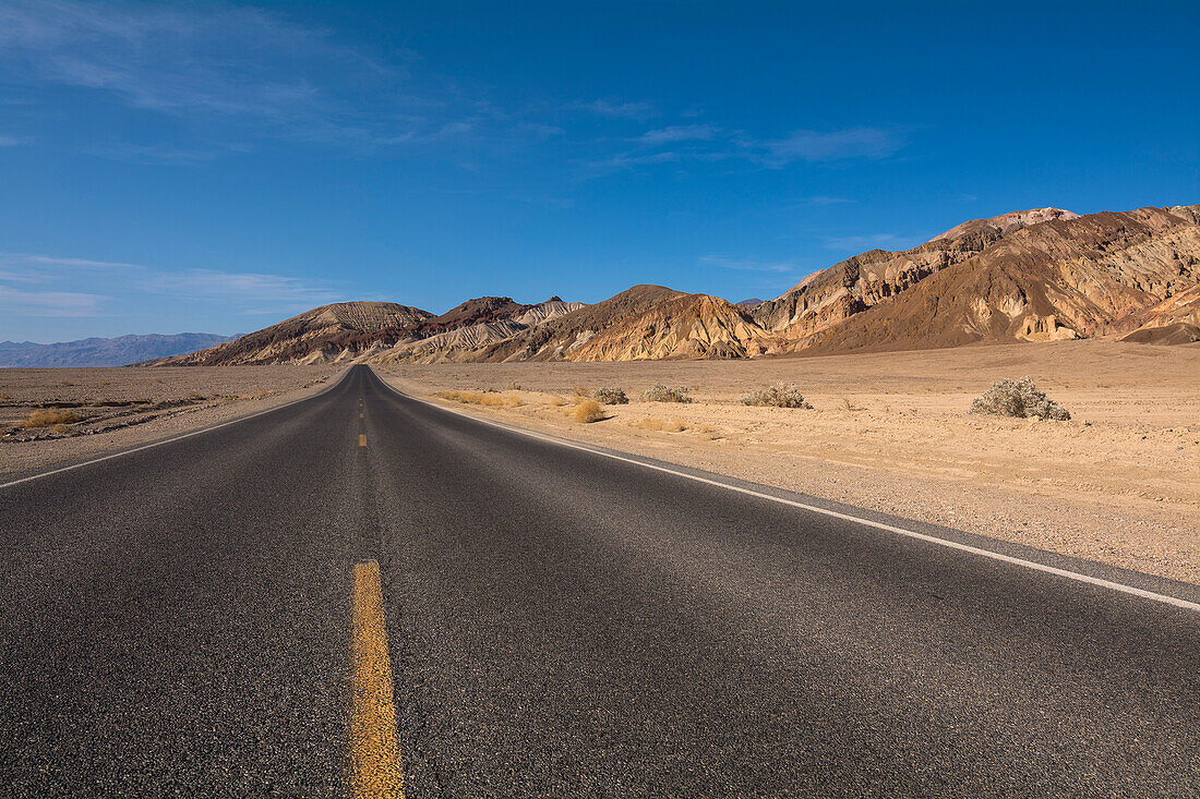 Paved Road in Desert Landscape, Death Valley National Park, California, USA