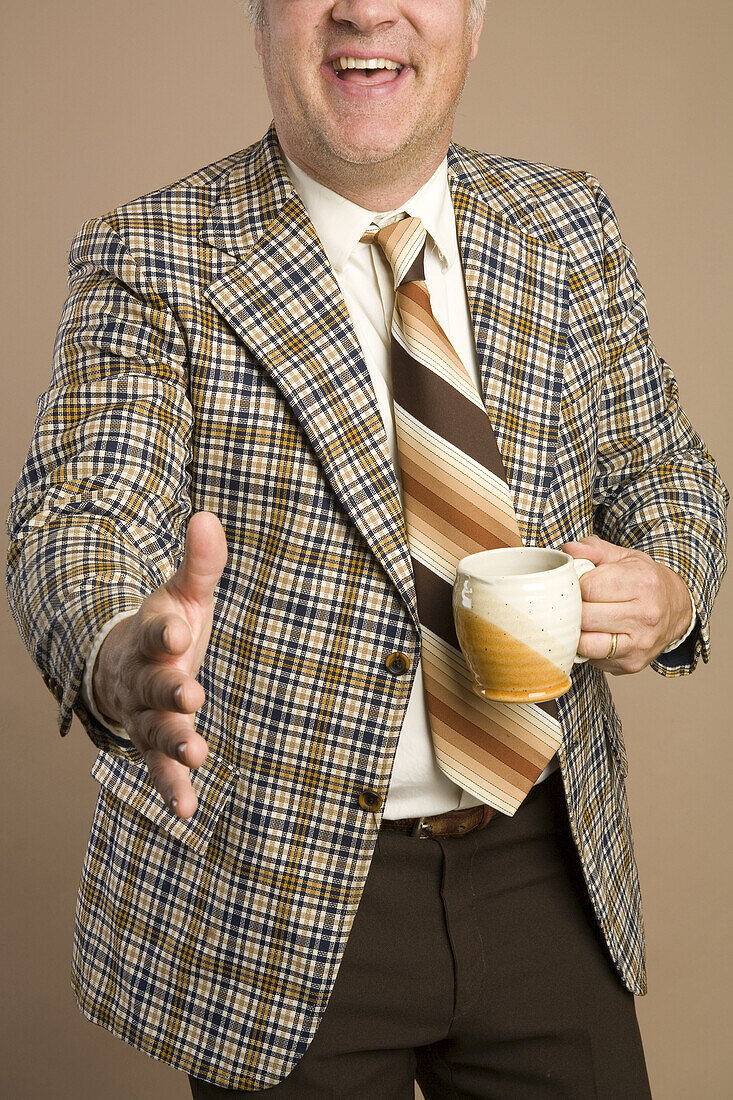 Retro Businessman With a Cup of Coffee Reaching for a Handshake