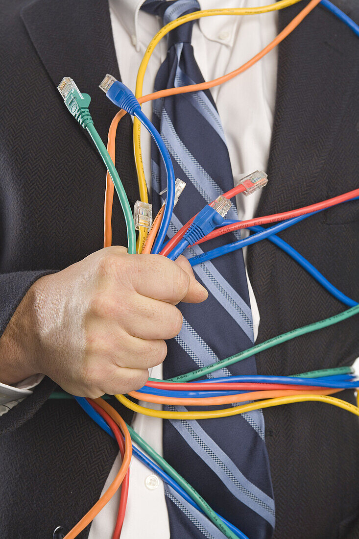 Close-up of Businessman Holding CAT5 Cables