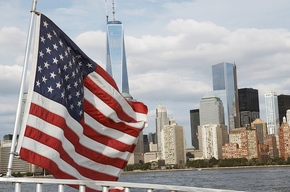 American Flag on Ferry with One World Trade Center and Skyline in Background, New York City, New York, USA