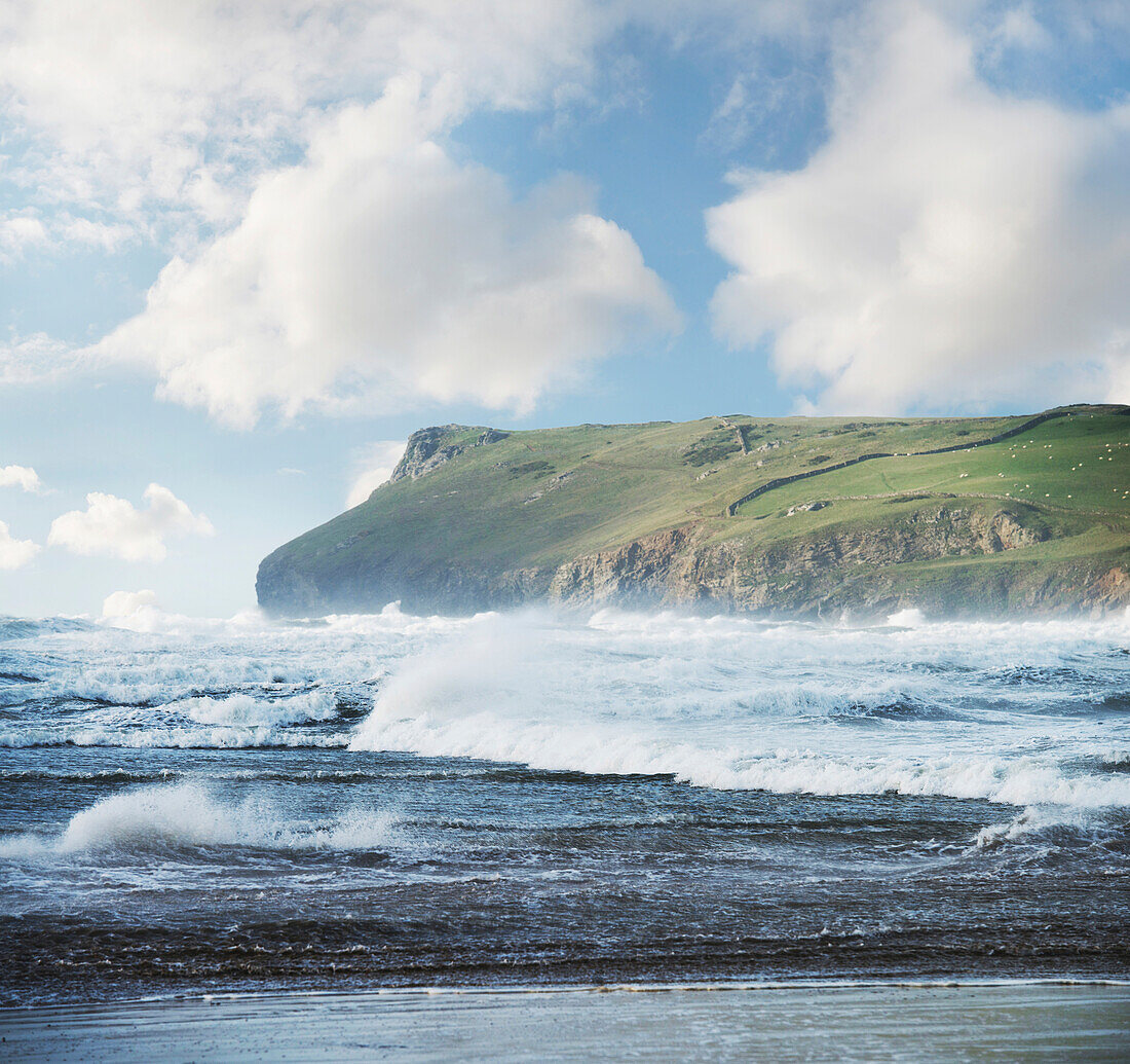 Scenic view of rough seas and headland, Polzeath, Cornwall, England