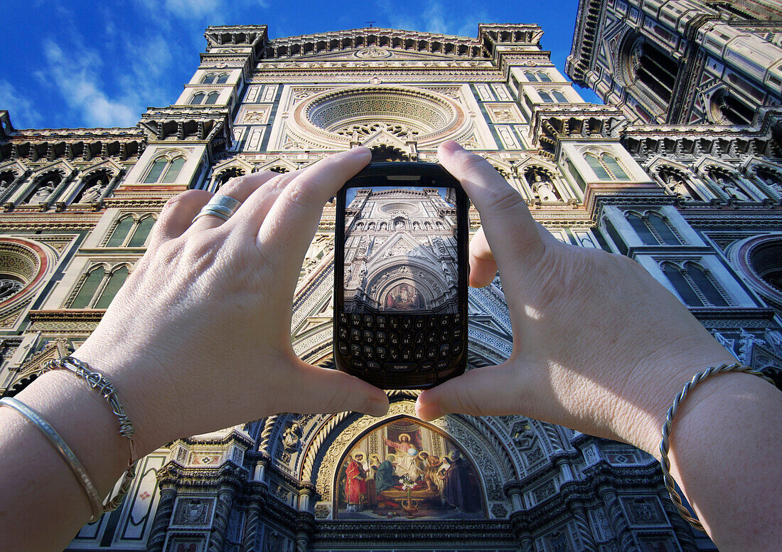 Woman's Hands Taking Photo of Basilica di Santa Maria del Fiore, Florence, Italy