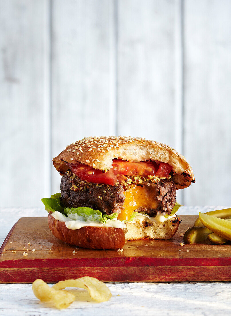 Cheese Filled Hamburger with Bites Taken, Studio Shot