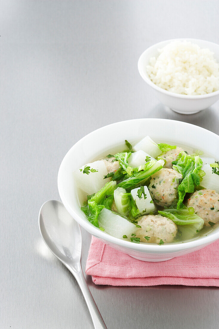 Bowl of Dumpling Soup with Side of Rice, Studio Shot