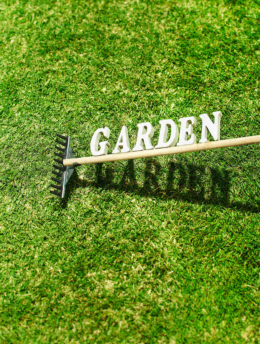 Garden Rake with the Text Garden on Grass