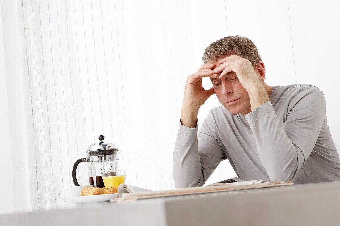 Man Reading Newspaper