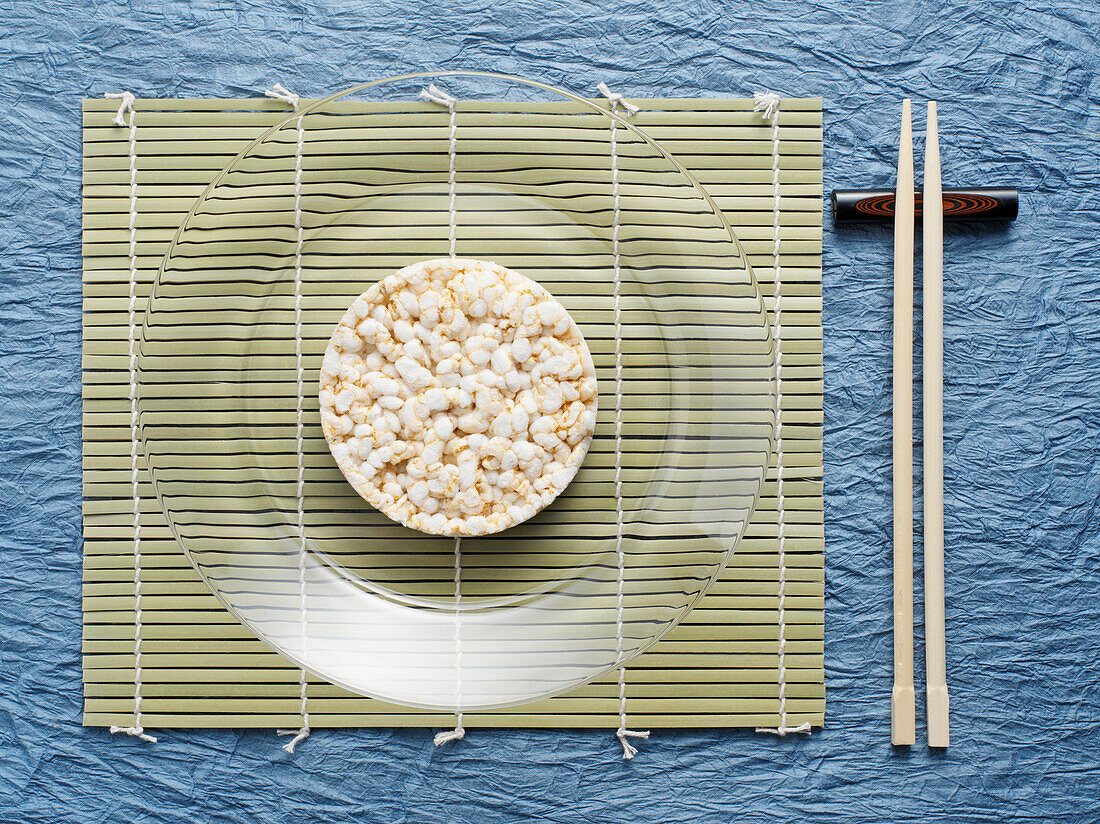 Overhead View of Rice Cake on Plate with Chop Sticks, Studio Shot