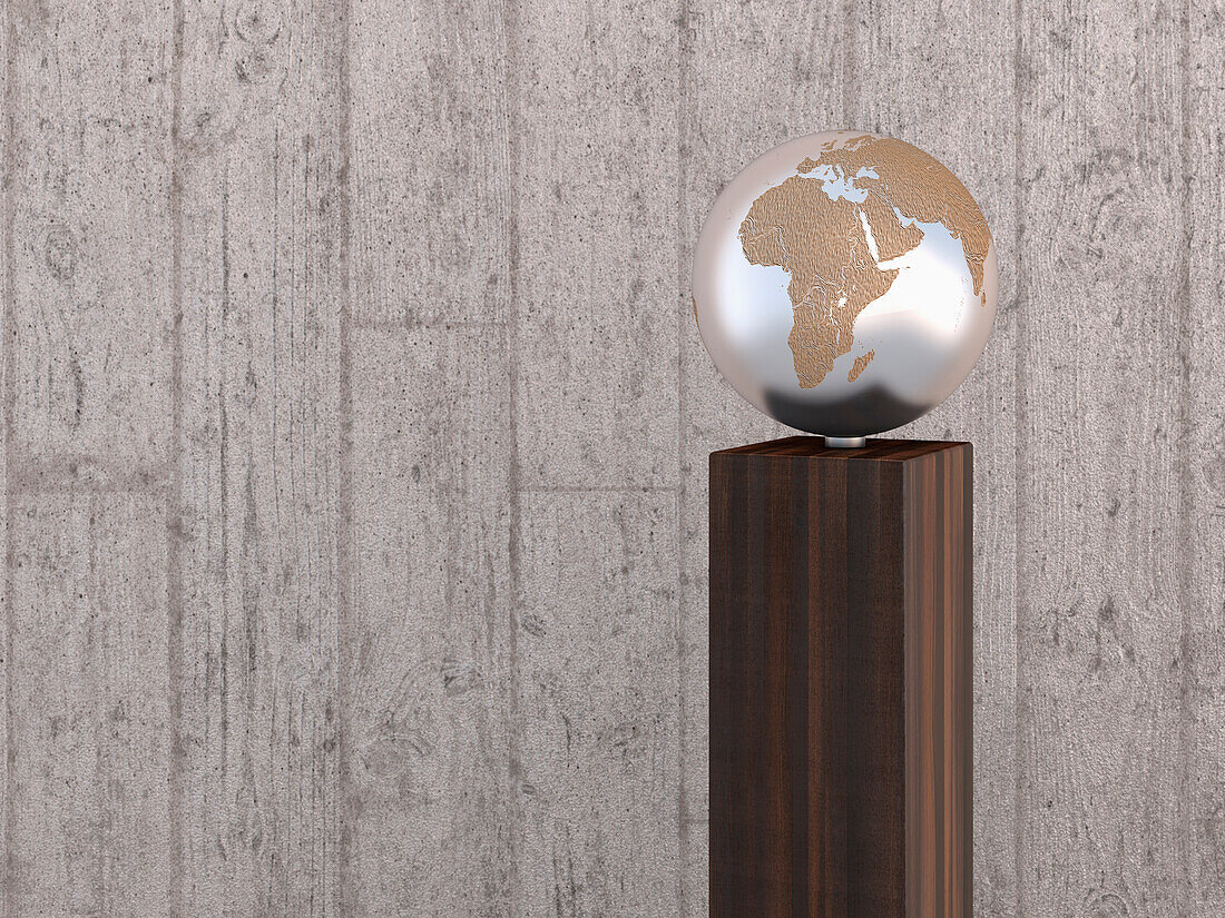 Illustration of metal globe on wooden stand, showing Africa, Europe and Asia, studio shot on grey, wooden background