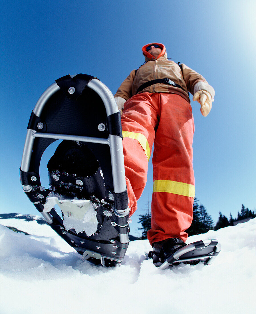 Man Wearing Snowshoes