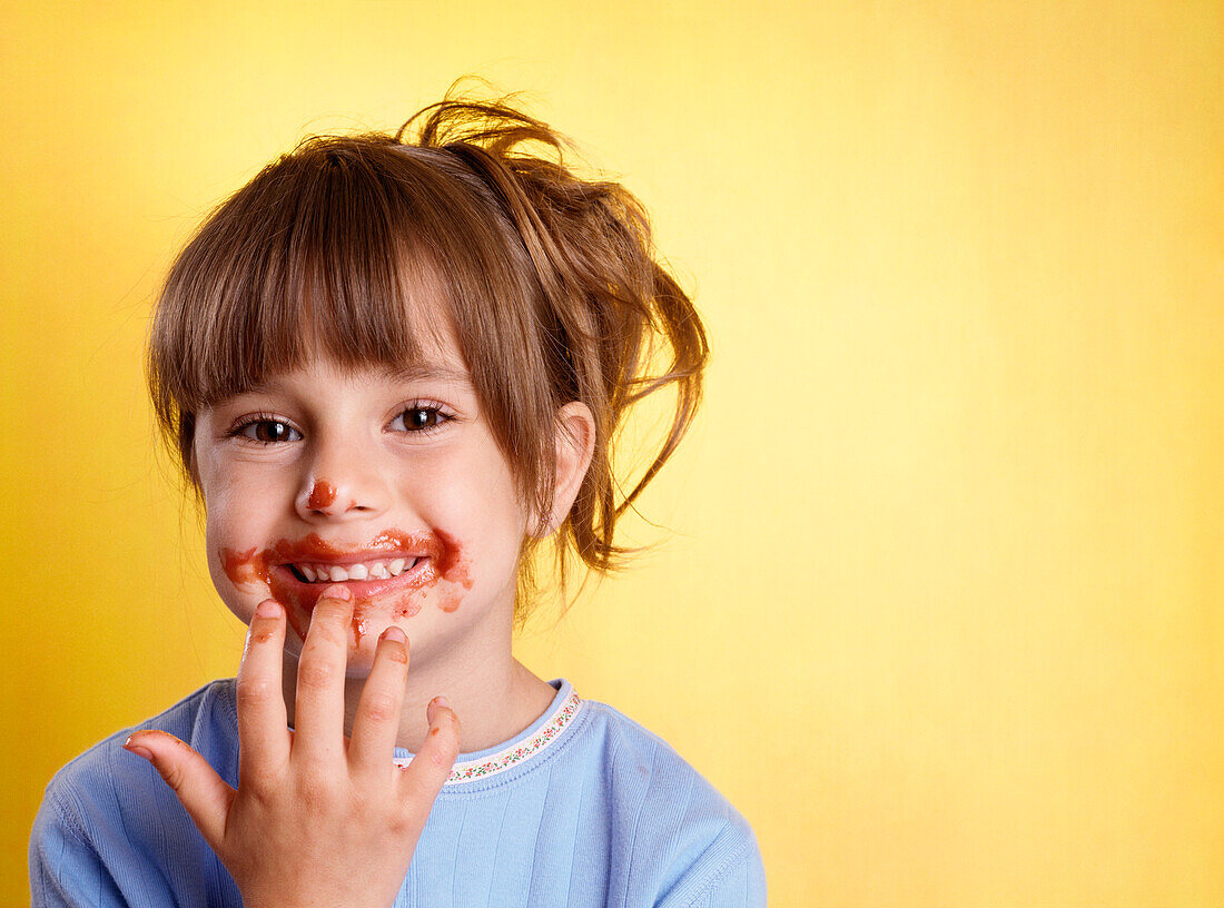 Portrait of Girl With Spaghetti Sauce on Face