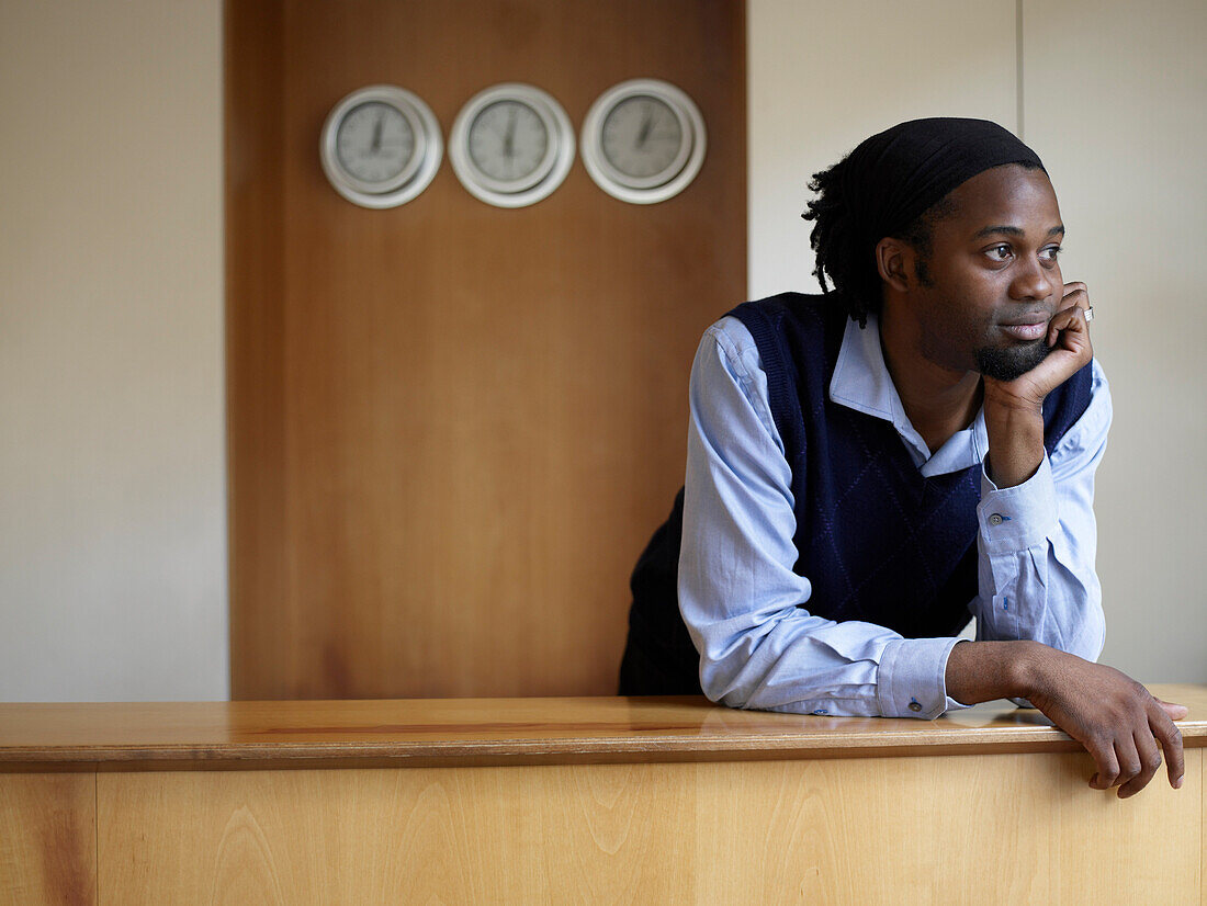 Portrait of Man Behind Desk