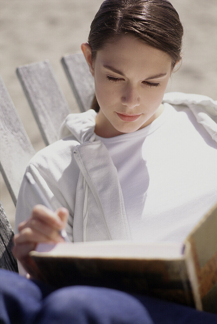 Woman Writing in Journal