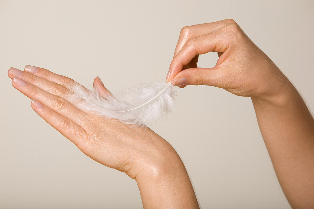 Woman Tickling Herself with Feather