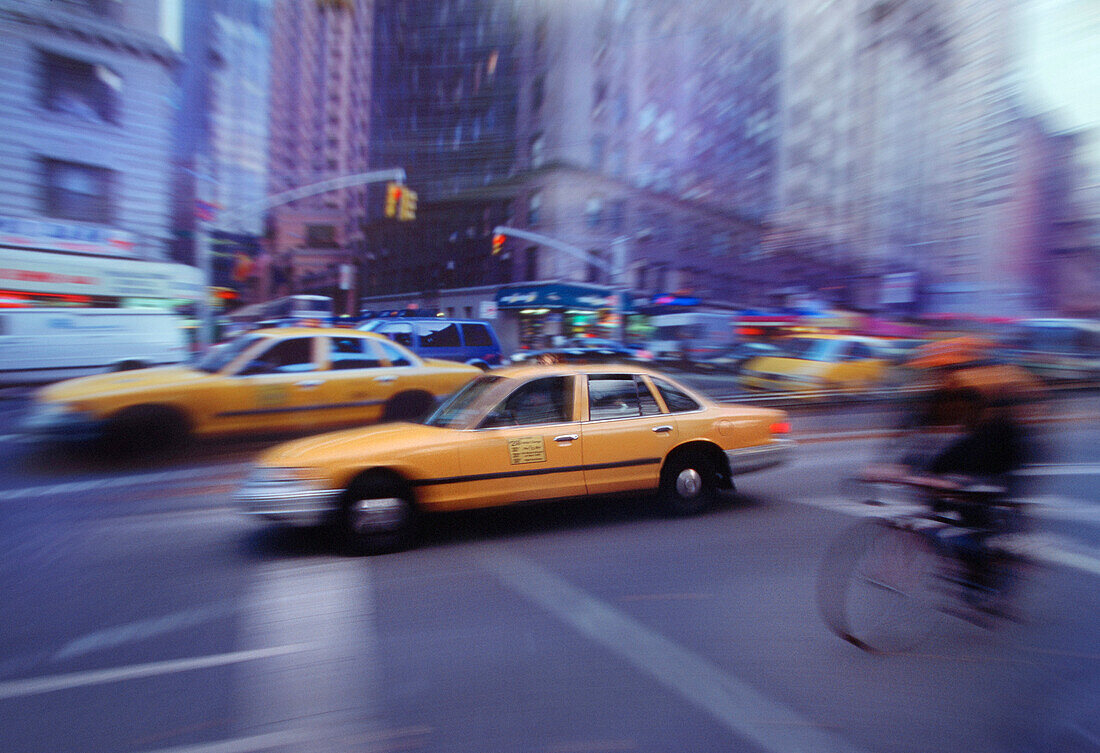 Blurred View of Taxis and Traffic On Street