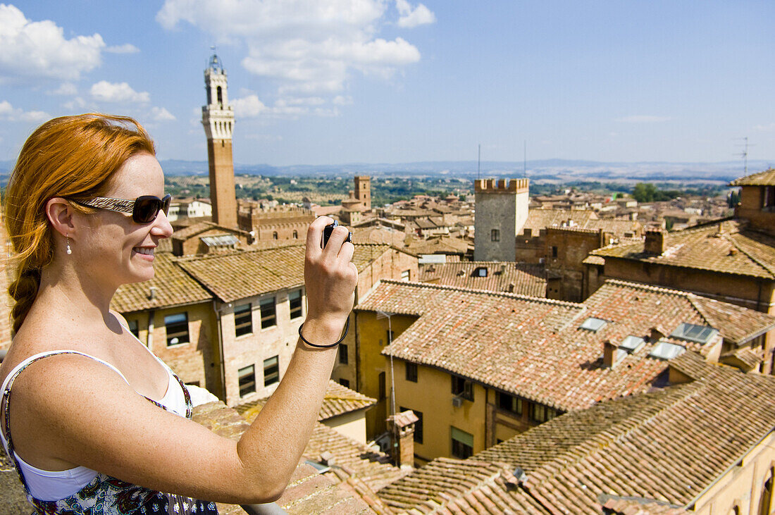 Woman Taking Photograph, Siena, Siena Province, Tuscany, Italy