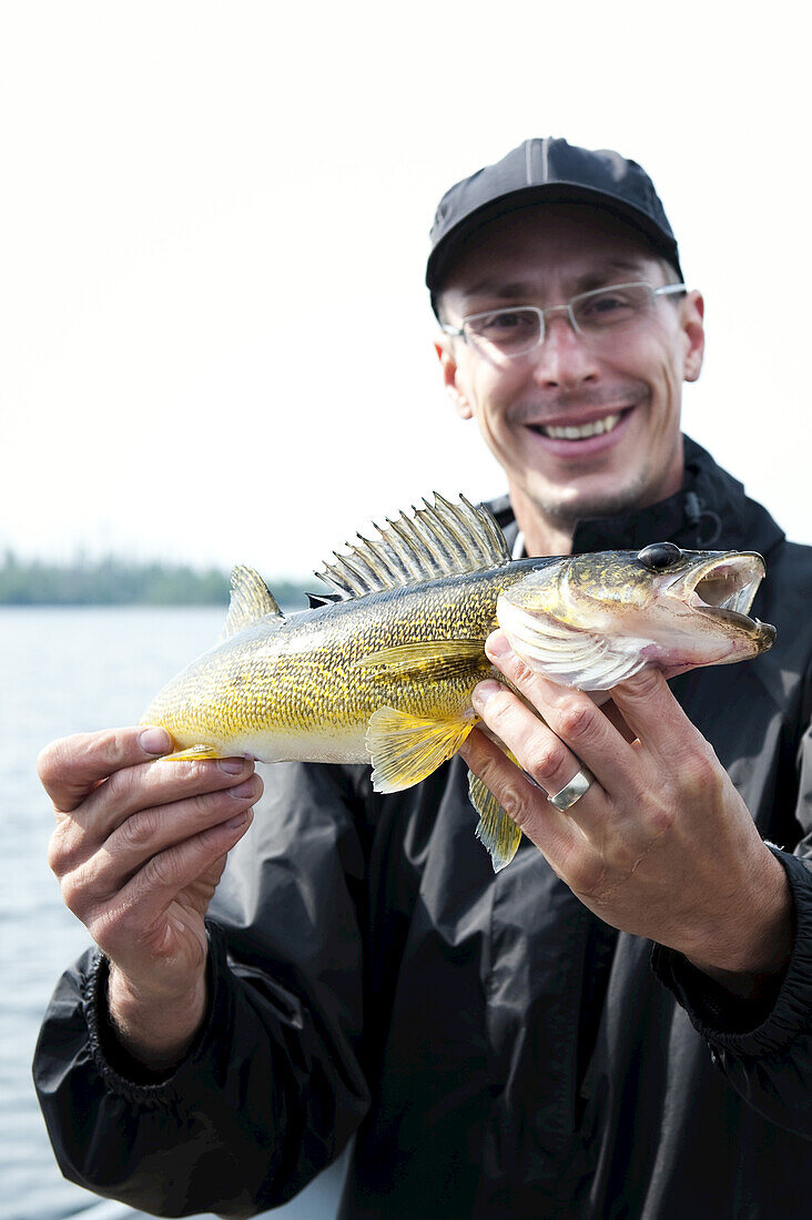 Man Fishing, Otter Lake, Missinipe, Saskatchewan, Canada