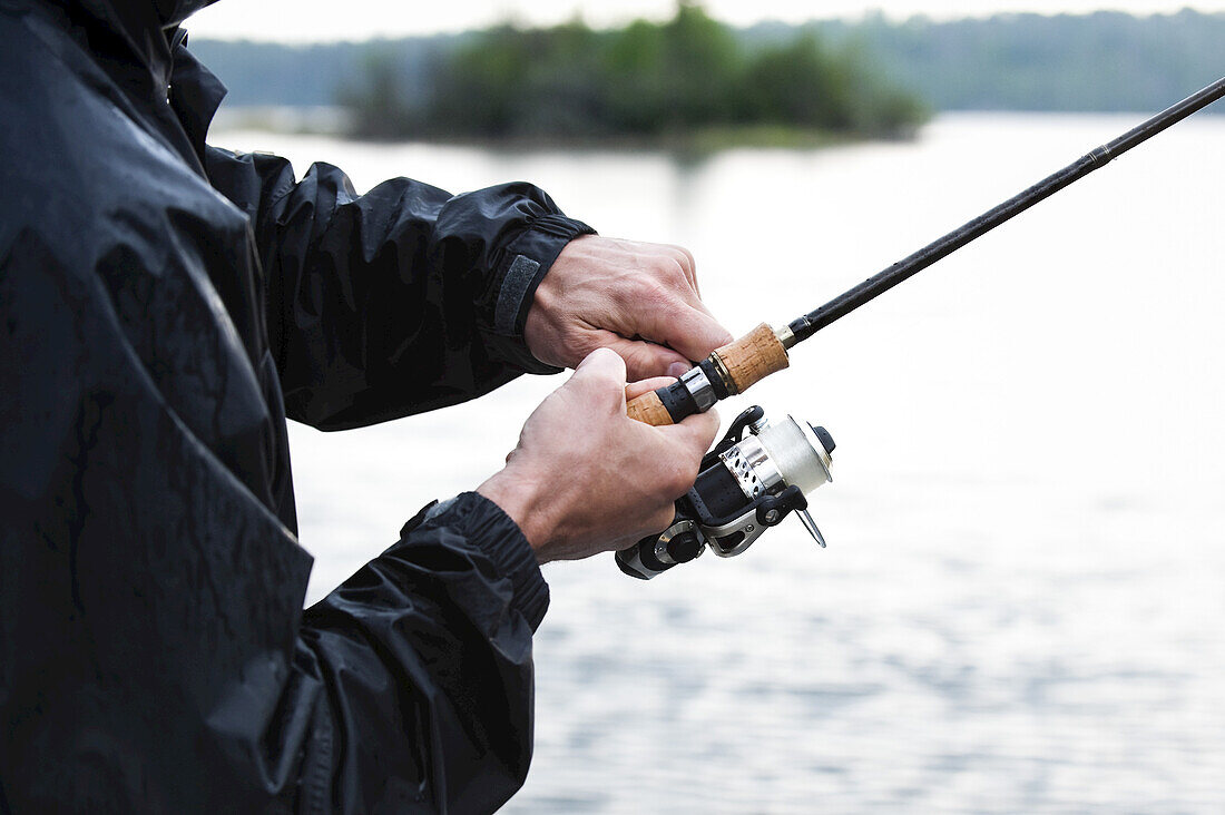 Man Fishing, Otter Lake, Missinipe, Saskatchewan, Canada