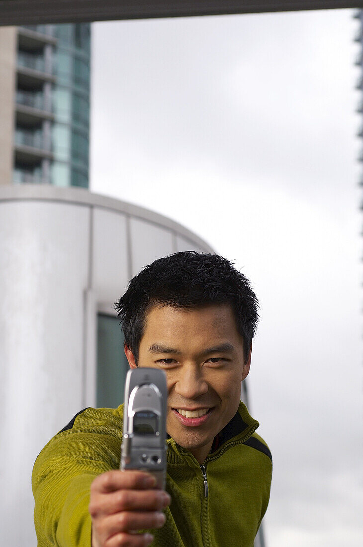 Man Taking Photo with Camera Phone