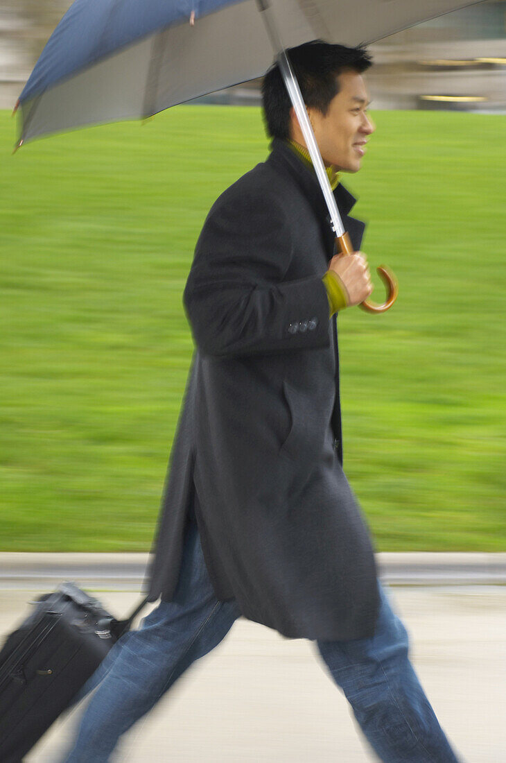 Man Walking Outdoors, With Umbrella