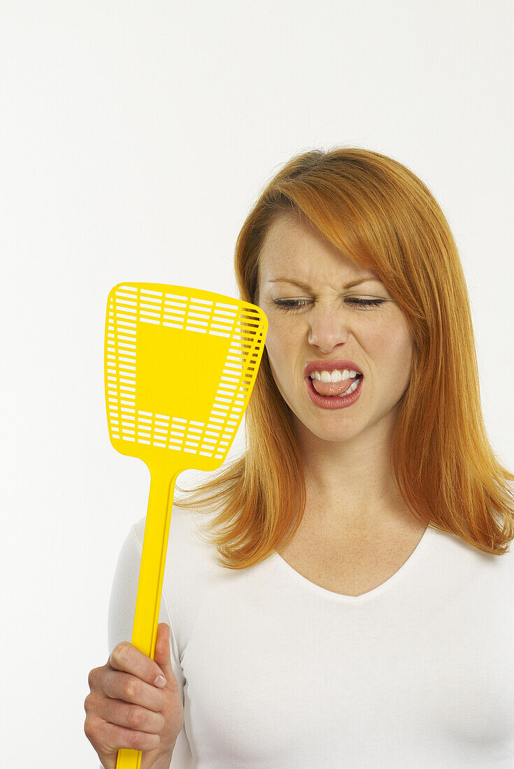 Woman Holding Fly Swatter