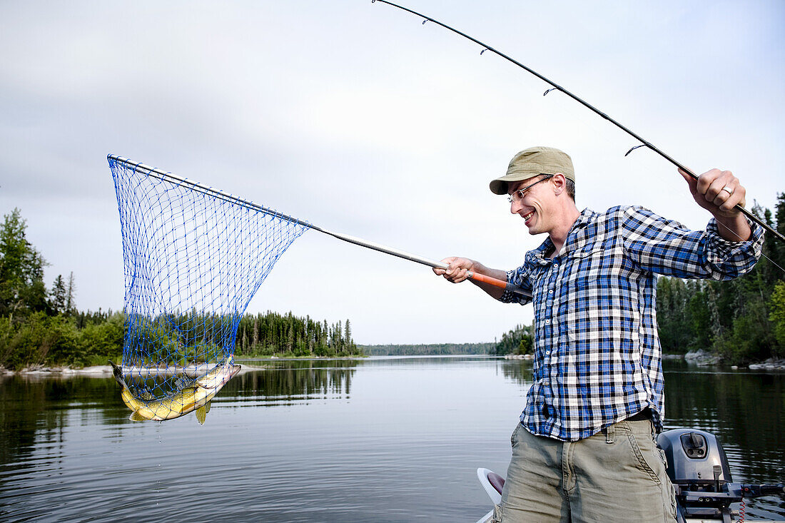 Man Fishing, Otter Lake, Missinipe, Saskatchewan, Canada