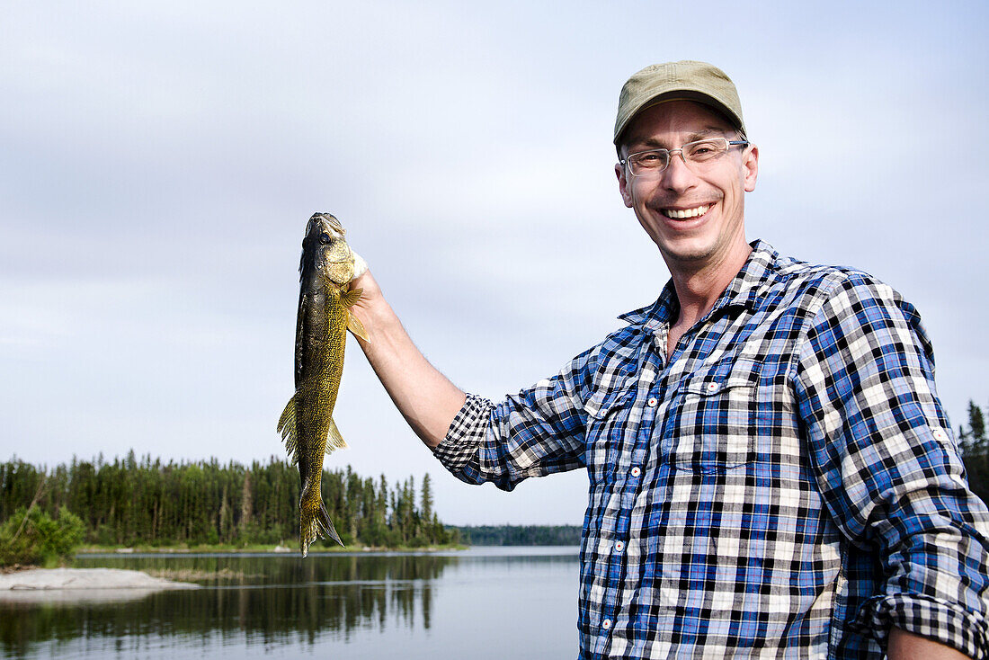 Man Fishing, Otter Lake, Missinipe, Saskatchewan, Canada