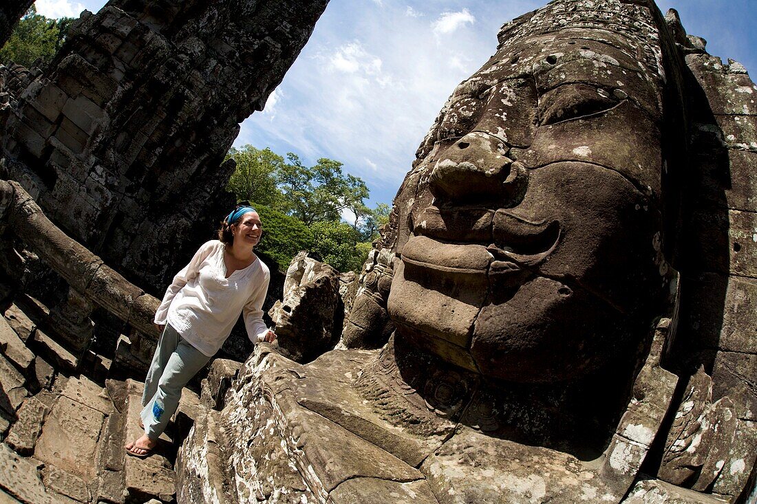 Tourist Outside Temple In Ancient City Of Angkor; Angkor Wat, Siem Reap, Cambodia