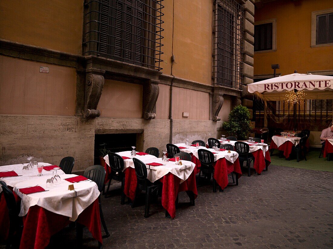 Outdoor Restaurant In Cosy Courtyard; Rome, Italy