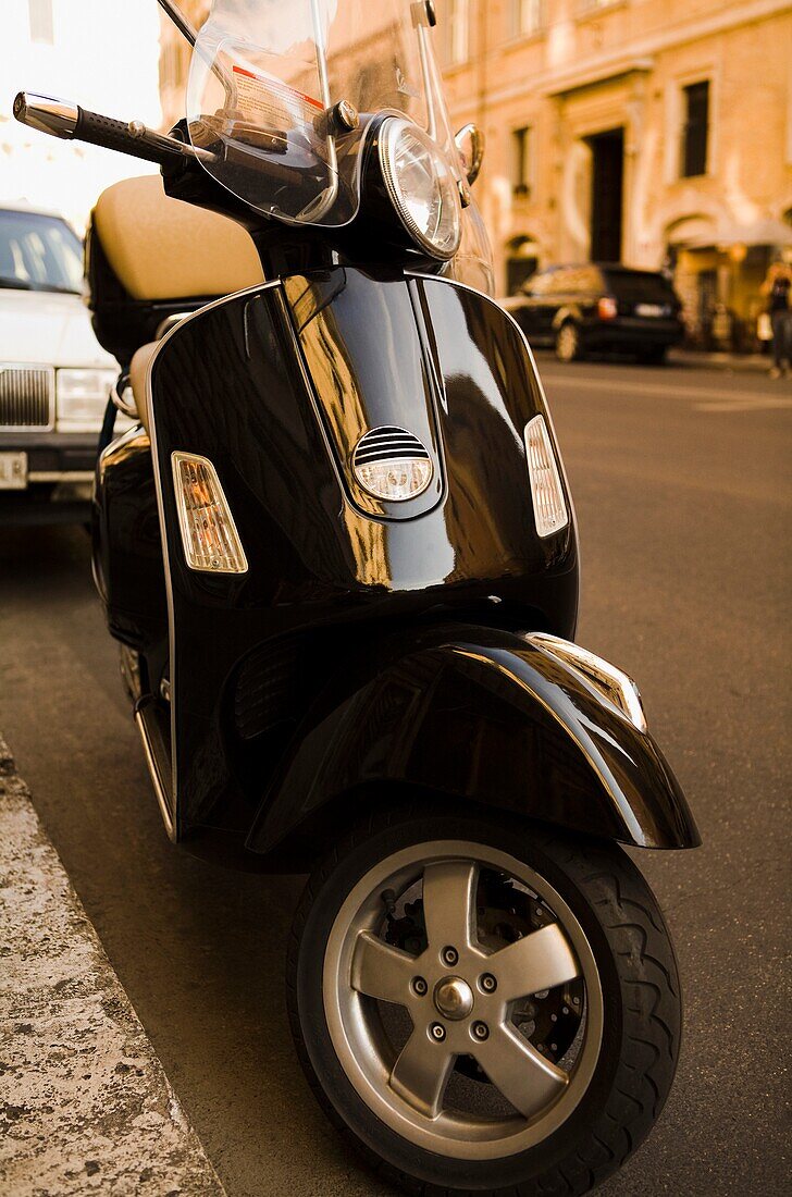 Motor Scooter Parked On Street; Rome, Italy