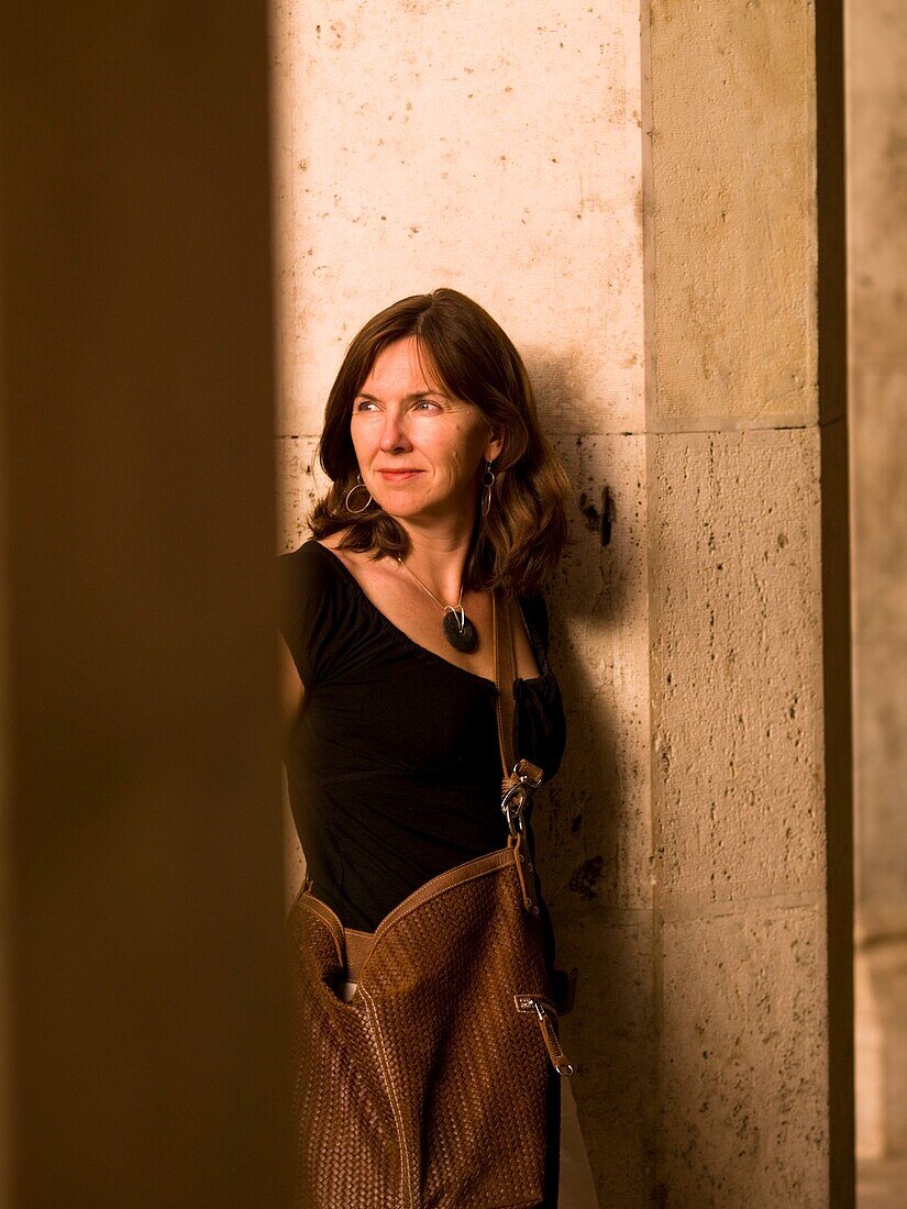 Middle-Aged Woman Leaning Against Column; Rome, Italy