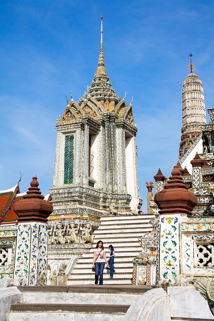 Women On Pagoda Steps At Wat Arun (Temple Of The Dawn); Bangkok, Thailand