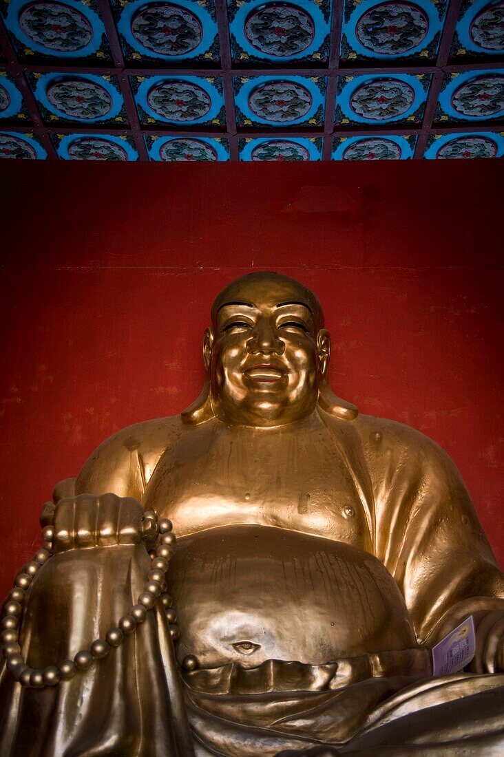 Golden Statue Of Smiling Buddha