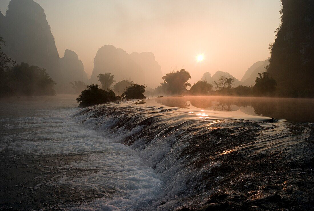 Frozen Pond In Mountain Area; Yulong River, Yangshuo, China