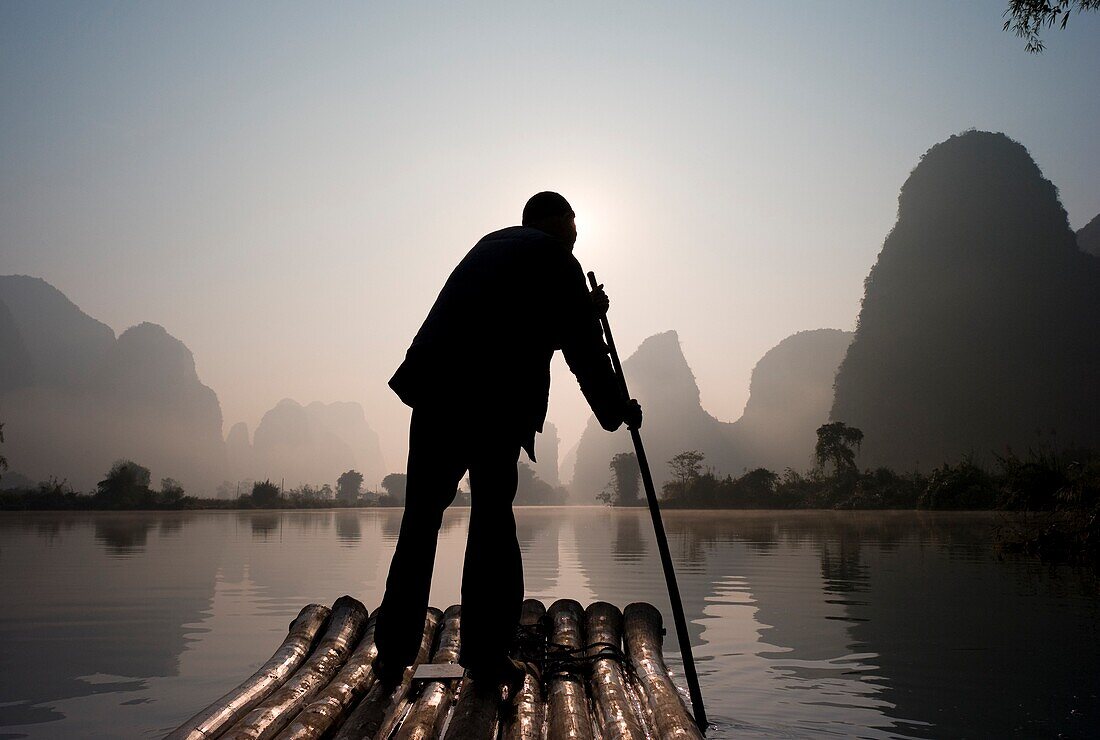 Man On Raft In Mountain Area